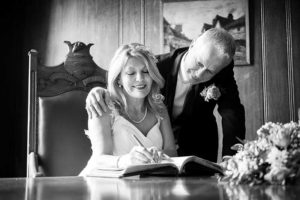 Signing the marriage register in the Mayor's Parlour at Worthing Town Hall